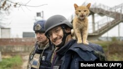 AFP journalist Arman Soldin (right) was killed by a rocket strike as he reported with AFP colleagues from Ukrainian positions in Chasiv Yar on May 9.
