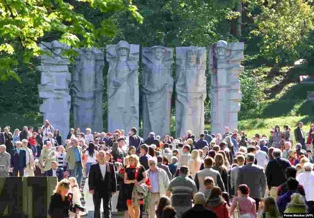 Crowds gather at a memorial to Soviet soldiers in the Antakalnis cemetery in Vilnius in May 2013. The brutalist sculptures were torn down in December 2022 after an earlier UN Human Rights Committee injunction had paused the work. 
