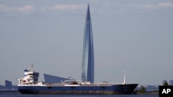 A tanker in the Finnish Gulf passes the Lakhta Center skyscraper, headquarters of Russian gas monopoly Gazprom, in St. Petersburg, Russia, in June.