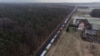 Trucks wait in line at the Polish-Ukrainian border at Hrebenne, southeastern Poland, on November 27.
