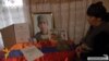 Armenia - The mother of Kyaram Sloyan, an Armenian soldier killed and decapitated by Azerbaijani troops in Nagorno-Karabakh, looks at his photogaphs, Artashavan, 10Apr2016.