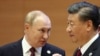 Russian President Vladimir Putin (left) and Chinese President Xi Jinping chat ahead of a summit in Samarkand, Uzbekistan, in September.