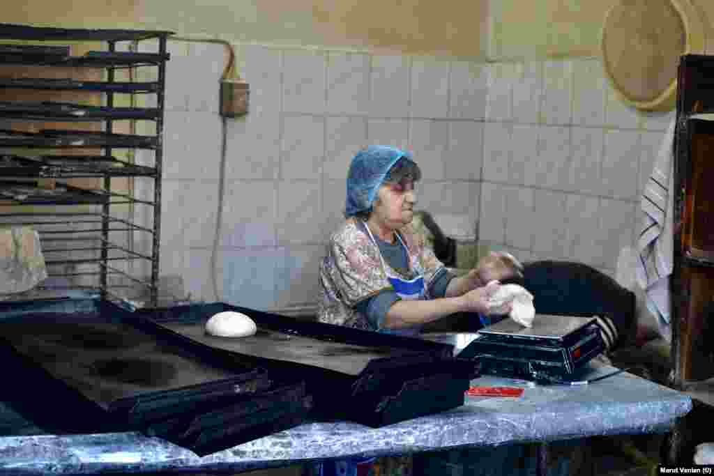 Lida Mikayelian portions dough in a bakery in Stepanakert. The baker told photographer Vanian: “There is still bread, thank God, but there are no vegetables at all.” The 87-year-old said the Russian peacekeepers tasked with protecting the Lachin Corridor have become increasingly toothless as Russia’s disastrous invasion of Ukraine grinds on. “Azerbaijan is using this moment to advance its plans,” Mikayelian said, adding, “Russia is not able to maintain our security, but at the same time, it doesn’t want to ‘lose’ us. This is the situation.”