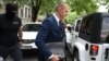 Blaz Jovanic is led away by police on May 9 in Podgorica.
