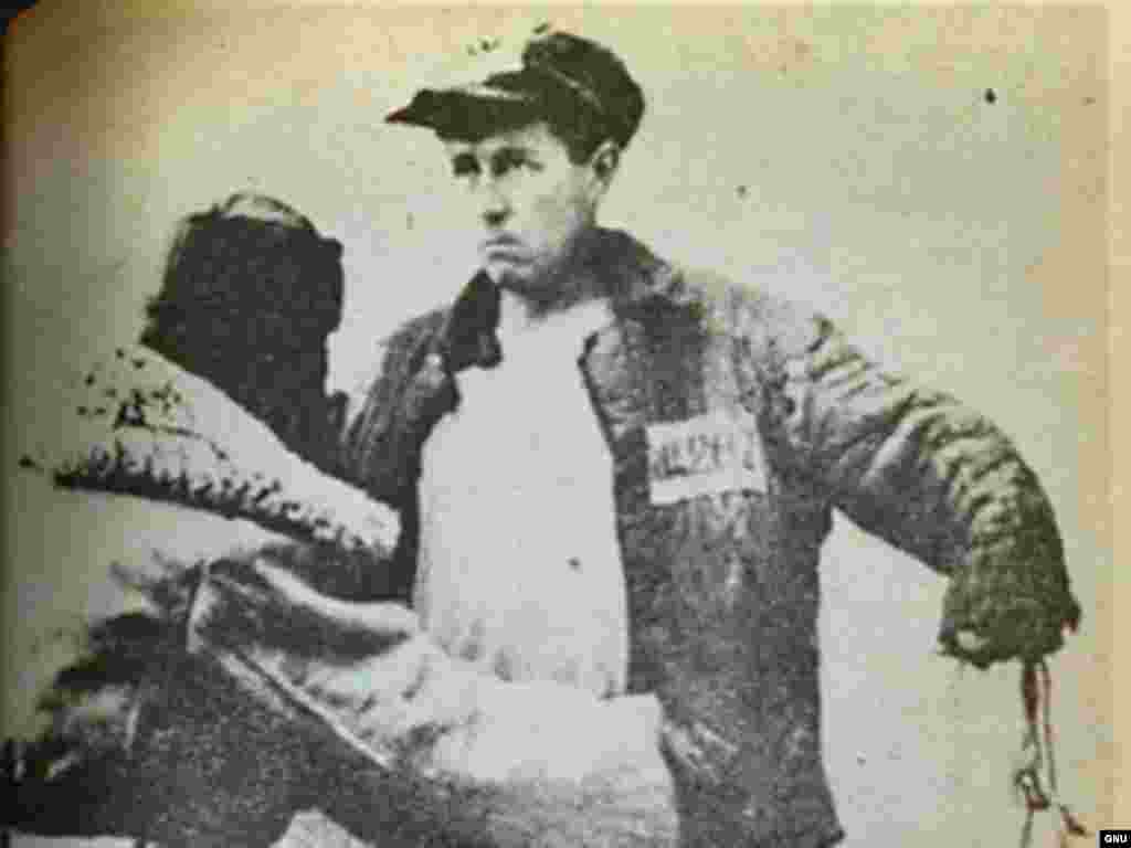 Denounced as a traitor in 1945, Solzhenitsyn was sent to gulags in Russia and Kazakhstan for eight years. The photo shows Solzhenitsyn, prisoner #282, being searched in 1953. After three more years of internal exile in Kazakhstan, he returned to Russia to work as a schoolteacher.