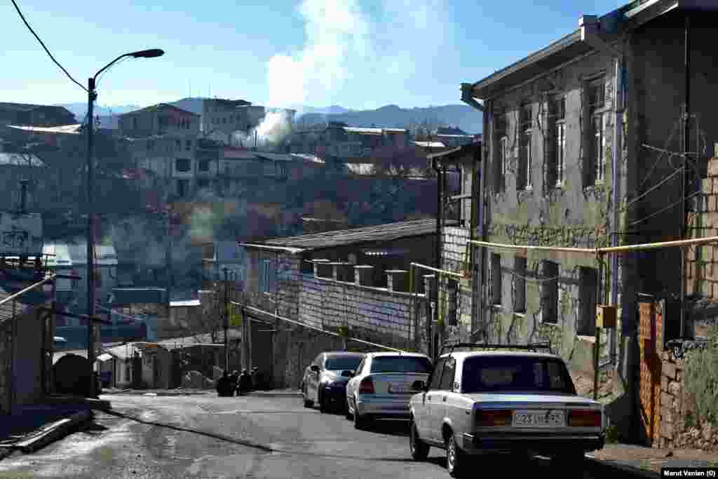 Smoke rises from houses in Stepanakert on December 19. As the blockade continues, some locals are continuing to use firewood to heat their homes due to its low cost. Local authorities have urged residents to reduce electricity usage amid fears vital electrical supply cables that run through Azerbaijani-held territory could be cut. 