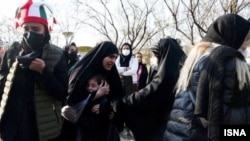 Female spectators gather outside the Mashhad stadium before the match between Iran and Lebanon in March.