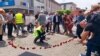 Victims' families and activists marked the anniversary by wearing white ribbons and gathering to lay red roses on the central square. 