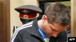 All three men in this photograph are police officers.