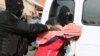 Armenia - Security forces detain a woman in a raid on a house in Yerevan's Nork district, 25Nov2015.