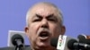 Afghanistan -- Afghan vice-presidential candidate Abdul Rahid Dostum, who is campaigning with presidential candidate Ashraf Ghani Ahmadzai, addresses the crowd during a gathering in the outskirts of Kunduz province, March 19, 2014
