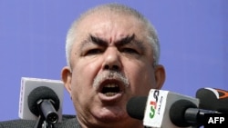 Afghanistan -- Afghan vice-presidential candidate Abdul Rahid Dostum, who is campaigning with presidential candidate Ashraf Ghani Ahmadzai, addresses the crowd during a gathering in the outskirts of Kunduz province, March 19, 2014