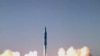 Iran -- A picture shows the test-firing of a new medium-range surface to surface missile, named Sejil-2, at an undisclosed location in Iran, 20May2009