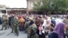 People waiting for the release of prisoners outside a prison in Dushanbe on October 28.