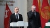 Belarus -- President Alyaksandr Lukashenka (R) and his Russian counterpart Vladimir Putin during a ceremony at the Great Patriotic War History Museum in MInsk, July 2, 2014