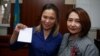 Aigul Aqberdieva (left) and her lawyer, Zhanar Sundetqalieva