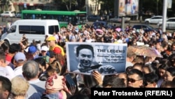 Mourners at the funeral for Denis Ten in Almaty on July 21.