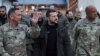 Ukrainian President Volodymyr Zelenskiy (center) arrives at a U.S. Army base in Wiesbaden, Germany, on December 14. 