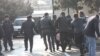 Police arrest two members of the band Bulistan at a youth opposition rally in Baku on March 17.