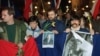 Czechoslovak students holding a picture of Vaclav Havel and poster reading "The Truth Will Win" march in support of Havel for president in December 1989 in Prague.