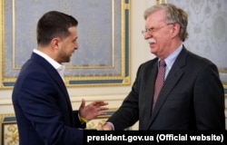 Ukrainian President Volodymyr Zelensky (left) and U.S. national-security adviser John Bolton in Kyiv on August 28.