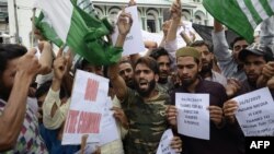 Protesters shout slogans at a rally in Srinagar on August 16 against the Indian government's move to strip Jammu and Kashmir of its autonomy and impose a communications blackout.