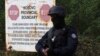 With rising tensions, a Kosovo police officer stands guard at the border crossing of Jarinje on September 20.