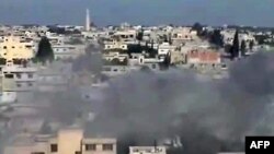 A video uploaded on May 23 shows smoke billowing from the rebel bastion of Al-Rastan.