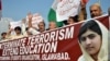 Pakistani demonstrators rally in Islamabad on October 16 against the assassination attempt by the Taliban on child activist Malala Yousafzai.