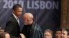 U.S. President Barack Obama (left) greets his Afghan counterpart, Hamid Karzai, before the opening session of the second day of the NATO Summit in Lisbon on November 20.