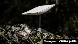 An antenna of the Starlink satellite-based broadband system is deployed in Izyum in Ukraine's Kharkiv region amid the Russian invasion.