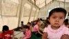 Local children play inside a tent on the outskirts of Osh in late August.