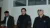 Kenzhebek Abishev, Oralbek Omyrov, and Almat Zhumagulov appear in court in October. 