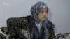 Nilufar Rajabova says that one of the arresting officers threatened to rape her. 