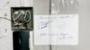 The doors of the RFE/RL's Minsk office were sealed after a raid by security forces in July. 