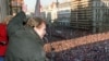 Czechoslovakia/Czech Republic - Vaclav Havel, dissident playwright and leading member of the Czechoslovak opposition Civic Forum, who drafted large parts of Charter 77, waves to the crowd of thousands of demonstrators, Venceslas Square, Prague, 10Dec1989