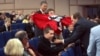 Members of the National Bolshevik Party shout slogans during Putin's speech at the congress