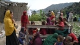 Afghan injured women and girls sit as they receive medical treatment at a field ollowing earthquakes in the Mazar Dara village of Nurgal, a district of the Kunar Province, in Eastern Afghanistan, on September 1, 2025.