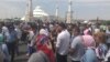 Arys residents protest near the Aqmeshit mosque on June 27.