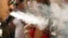 A man smokes a cigarette in a cafe in Rostov-na-Donu. Russians may have to forget about lighting up indoors if a tough new law passes as expected.