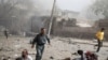 Survivors run past fallen bystanders at the scene of the Indian Embassy bombing in Kabul