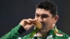 Dilshod Nazarov stands on the podium during the medal ceremony for the men's hammer throw final during the athletics at the Rio 2016 Olympic Games at the Olympic Stadium in Rio de Janeiro in August 2016.