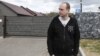 Eduard Palchys takes part in a protest against the building of a restaurant near the Kurapaty memorial to the victims of Stalinist repressions outside Minsk in 2018.