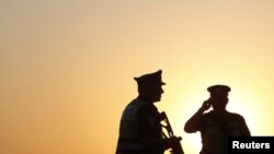 Israeli security officers patrol at a roadblock near the Egyptian border