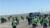 Videos and photos that circulated on social media showed hundreds of workers in hard hats and uniforms massing at a site near the Tengiz oil field. 