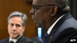 U.S. Secretary of State Antony Blinken (left) looks on as Defense Secretary Lloyd Austin testifies during a Senate hearing in Washington, D.C., on October 31. 